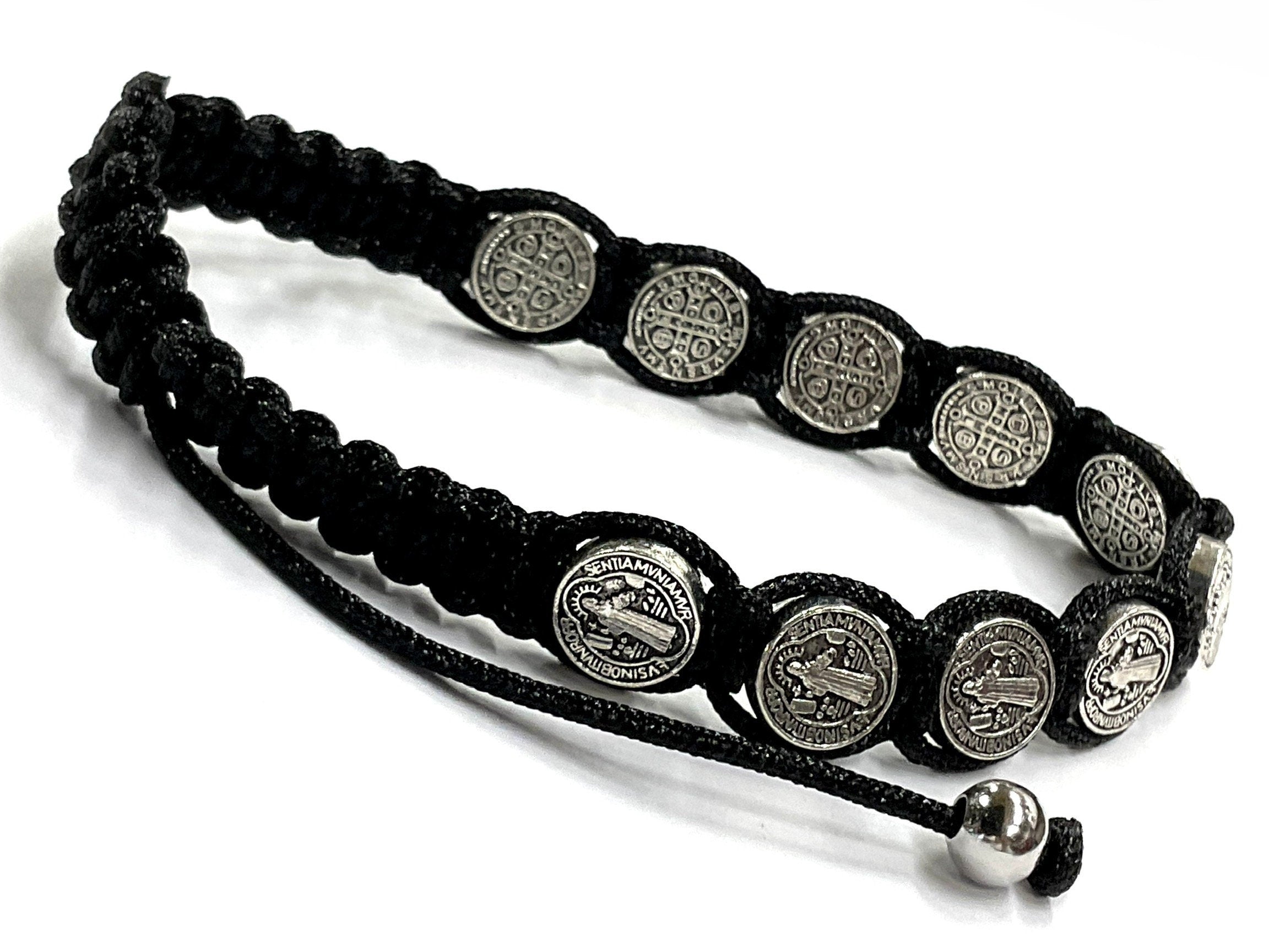 Black woven string bracelet with round silver-tone coin charms and adjustable pull loop