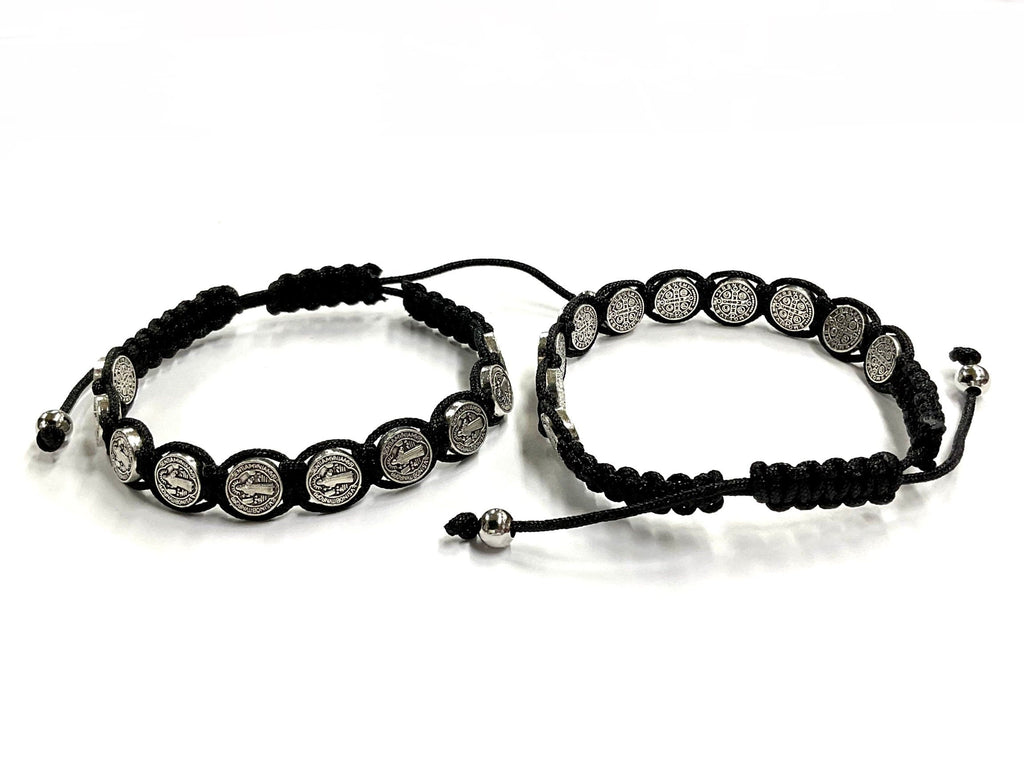 Two black woven string bracelets with round silver-tone coin medallions and pull ties