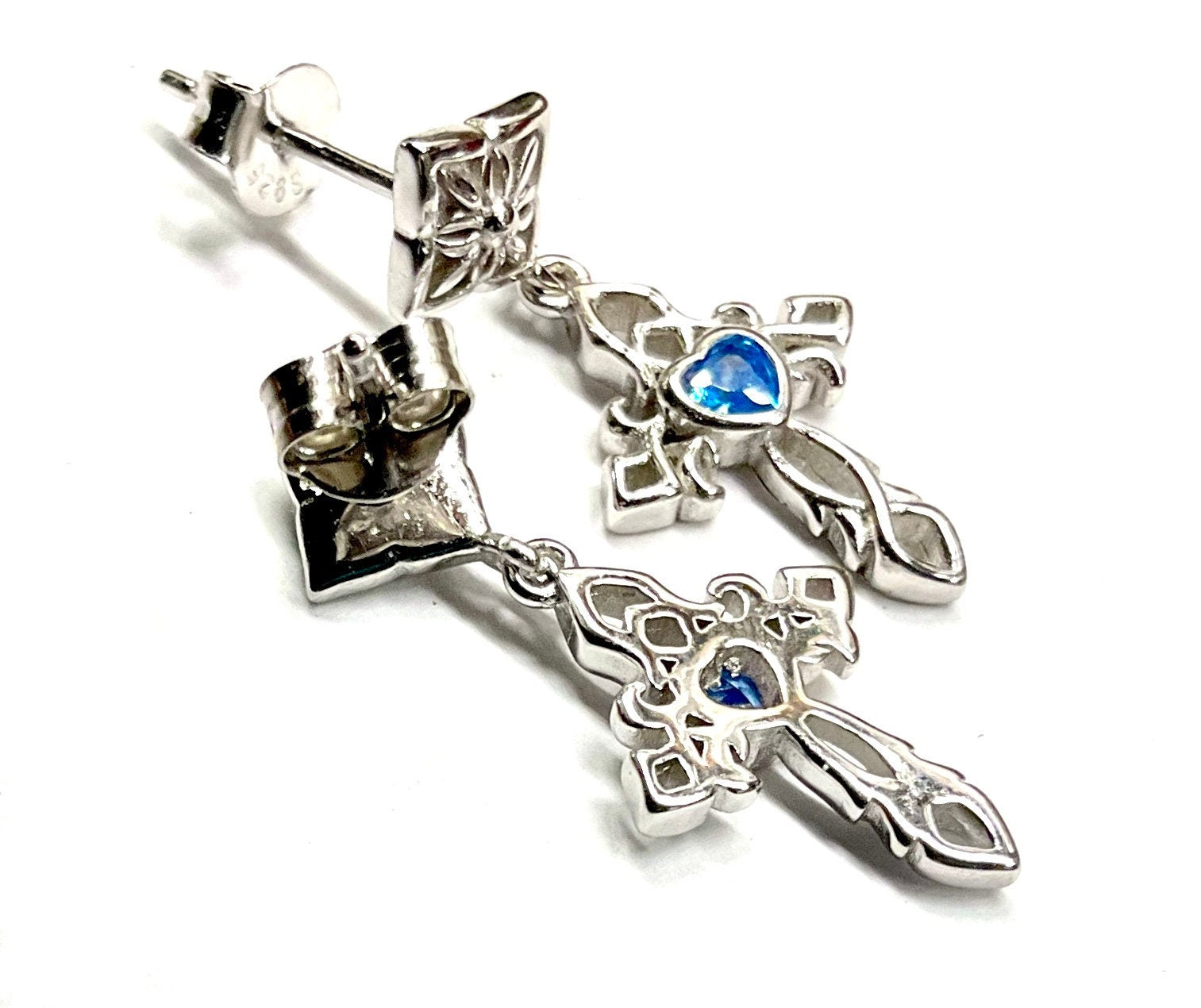 Sterling silver cross dangle earrings with blue zircon center stone and chain details