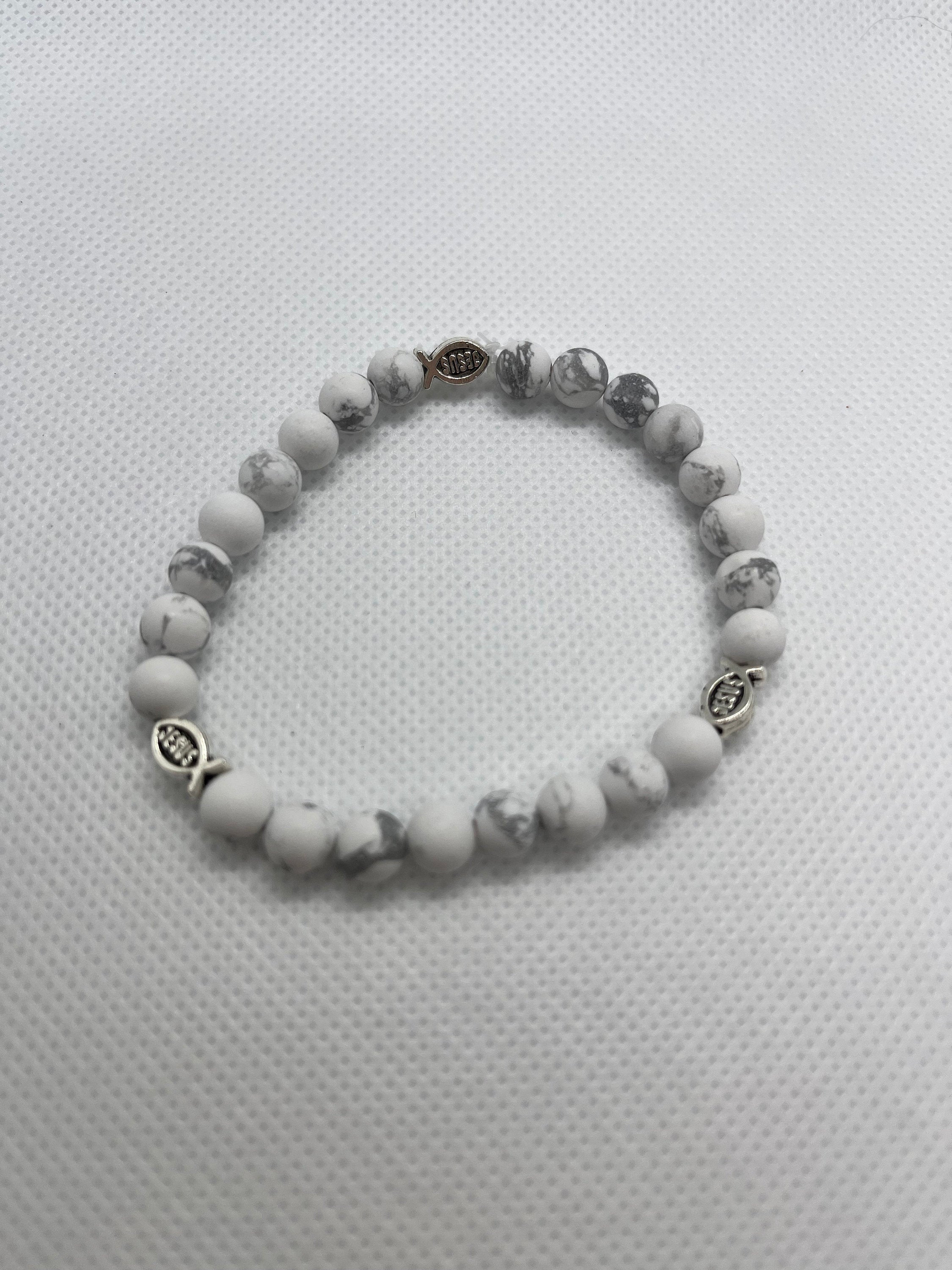 White marble beaded bracelet with fish charm and dark metal spacer beads
