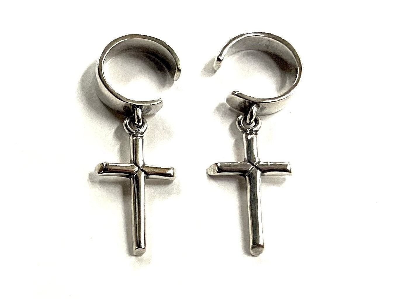 Pair of sterling silver cross dangle ear cuffs with circular clamp openings