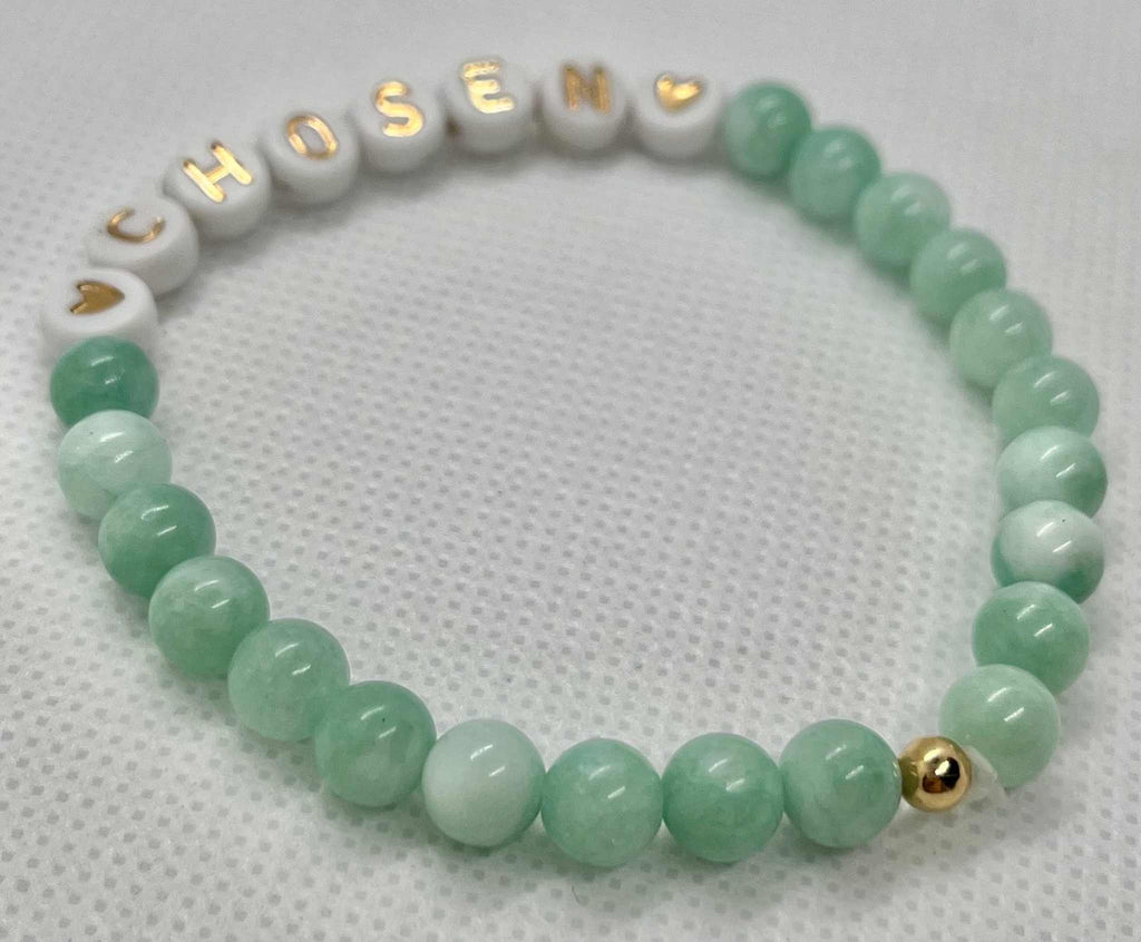 Jade green bead bracelet with white CHOSEN beads and gold clasp bead at side