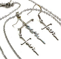 Silver cross pendant necklace with dangling cross-and-script earrings