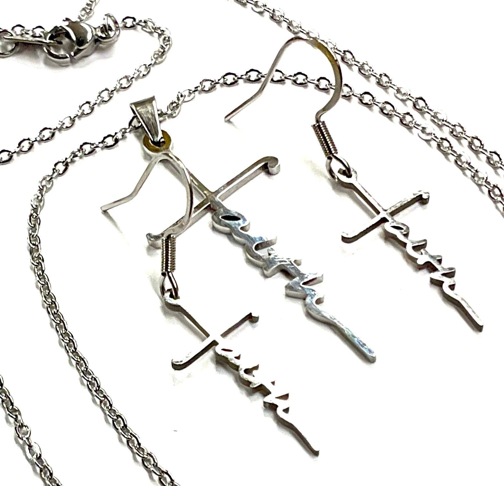 Silver cross pendant necklace with dangling cross-and-script earrings