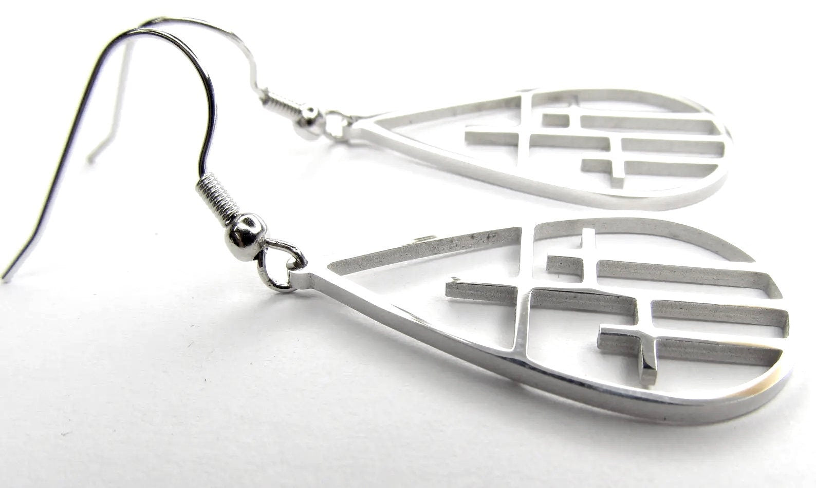 Silver-tone teardrop cross drop earrings with fishhook backs and cross cutouts