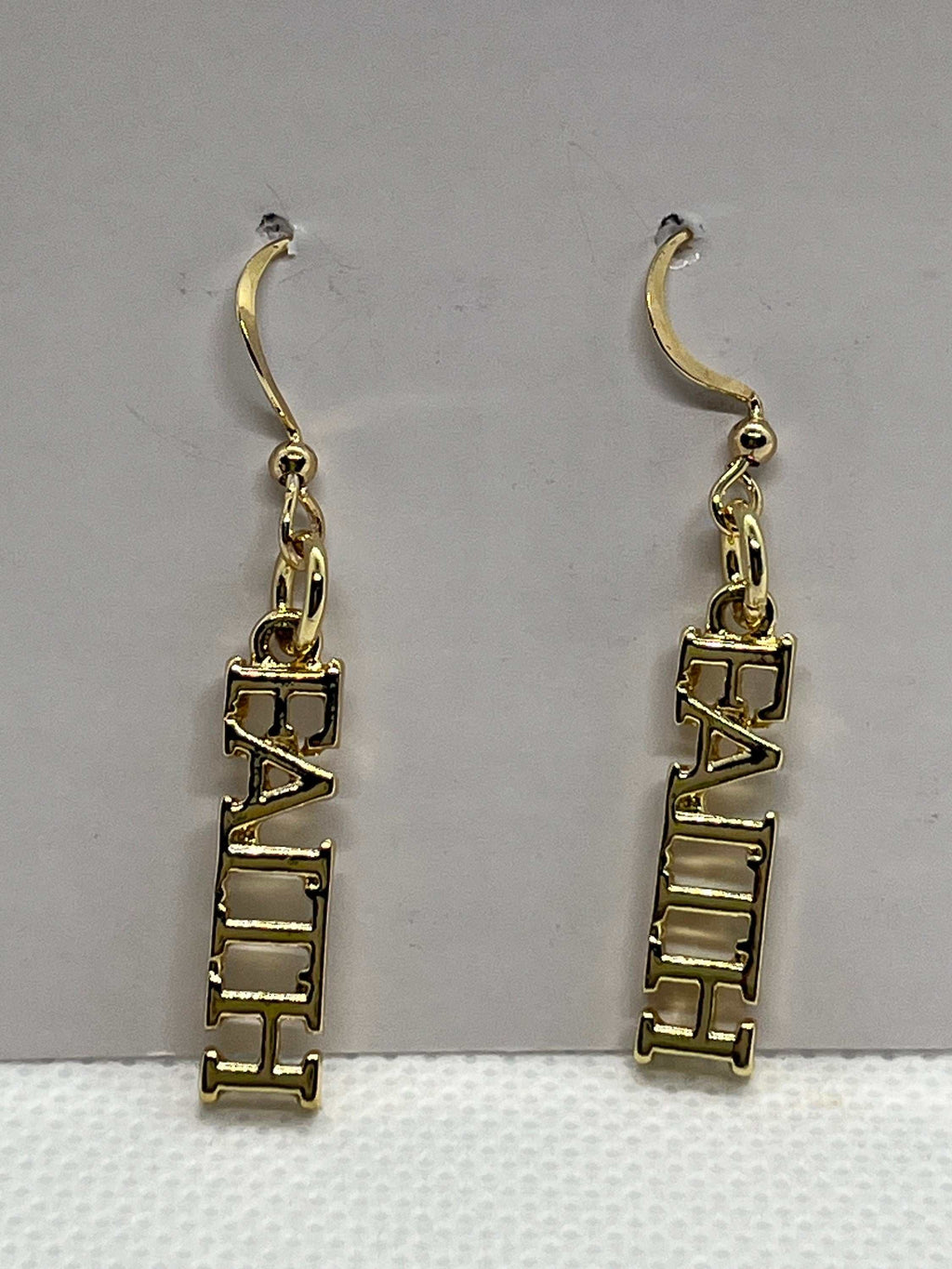 14K gold faith dangle earrings with FAITH block letters and chain accents
