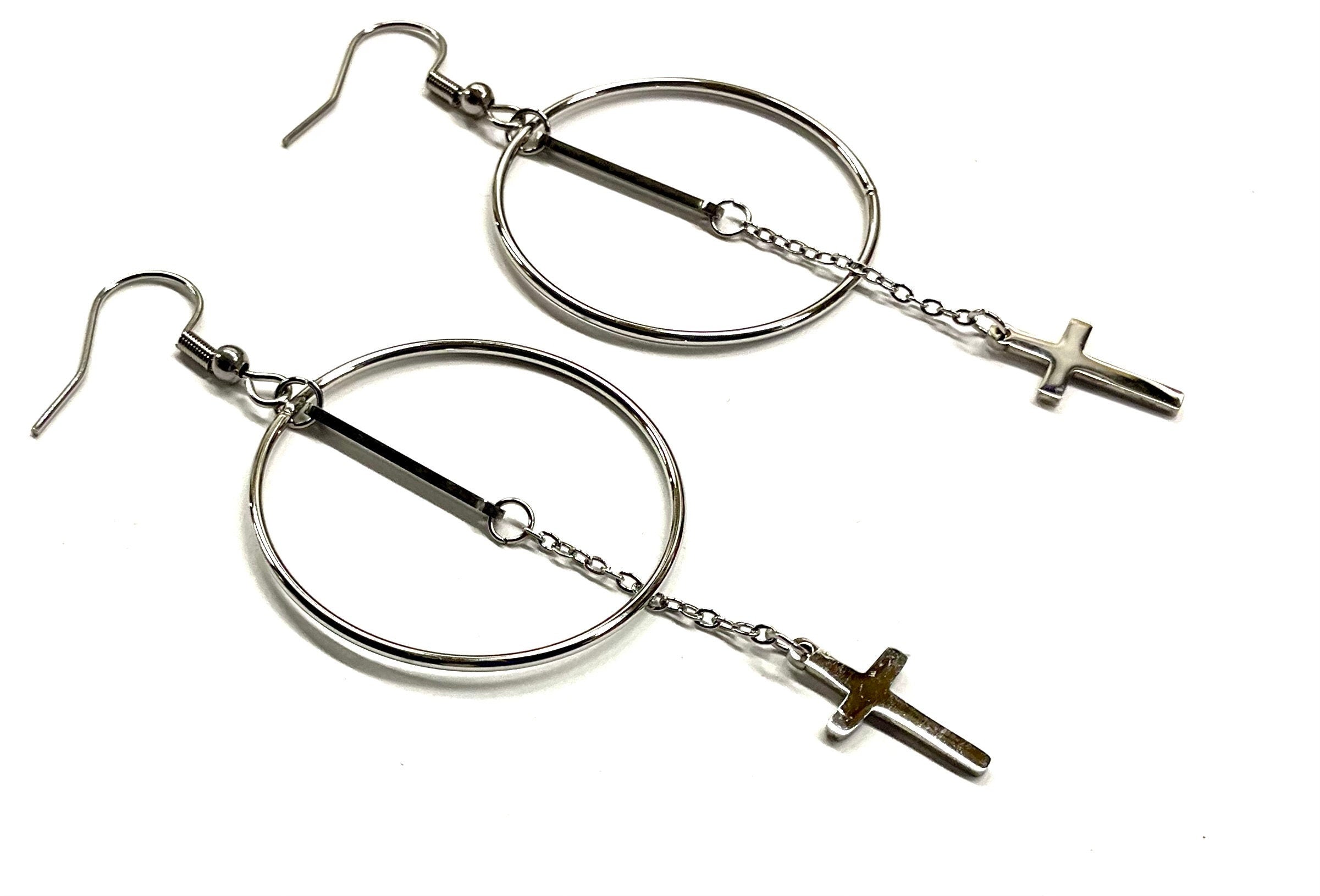 Silver-tone hoop earrings with long chain dangle and cross pendant charms