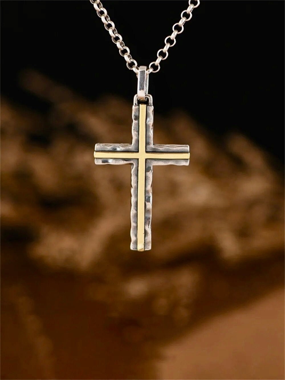 Silver cross pendant necklace on chain with hammered texture and brass inlay