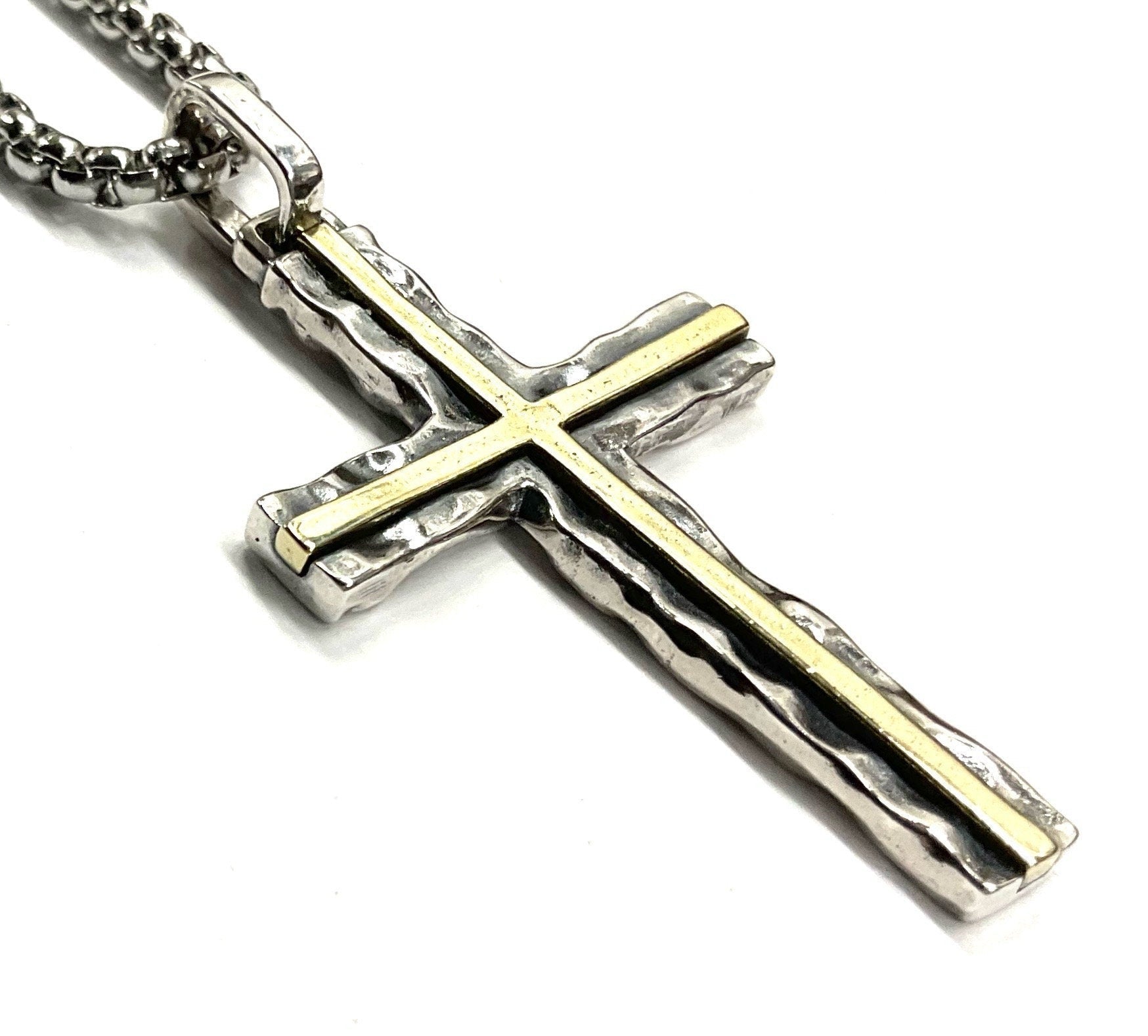 Silver cross pendant with long arms and brass inlay lines on a chain