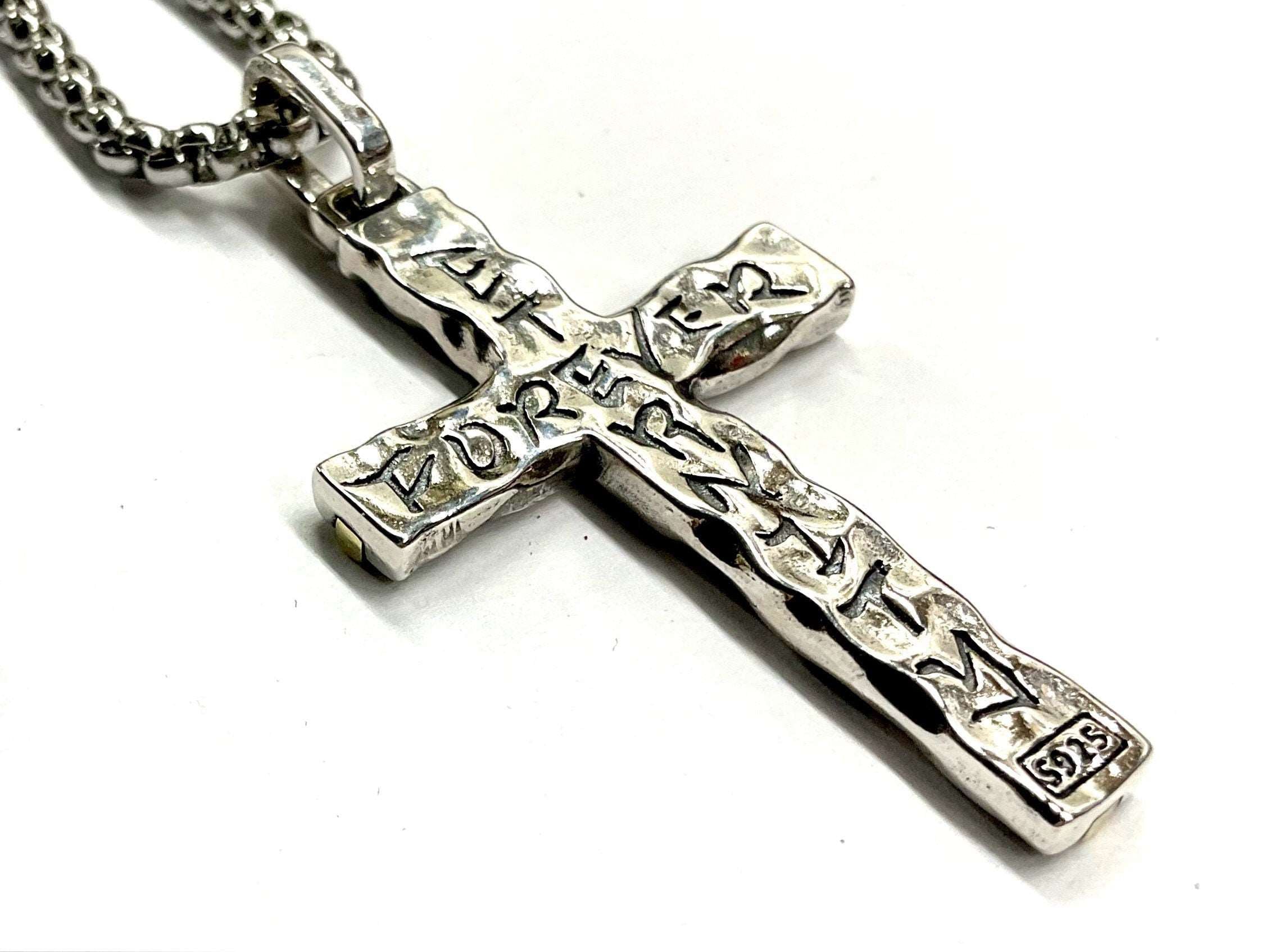 Hammered silver cross pendant with brass inlay and engraved edges on chain