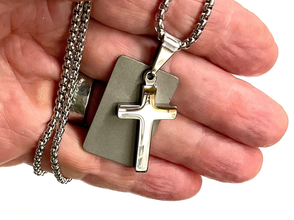 Silver cross dog tag necklace pendant close-up with chain