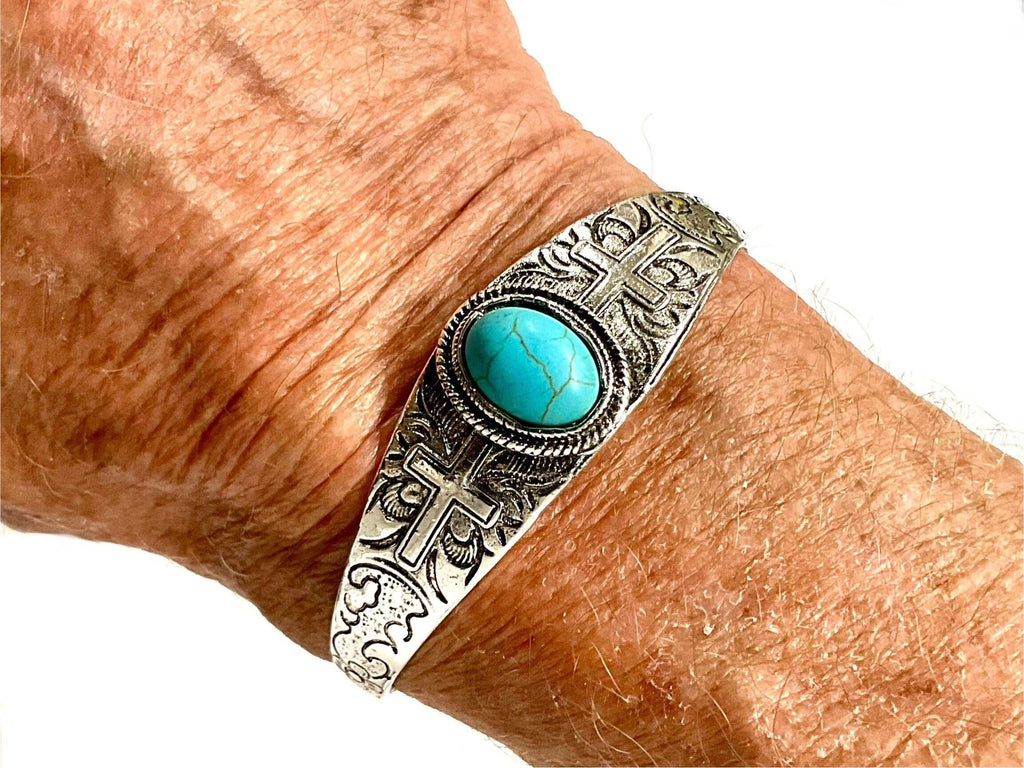 Silver-tone cuff bracelet with turquoise stone and cross stamped bohemian trim