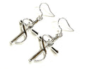 Twisted cross drop earrings with central zircon, silver-tone hooks