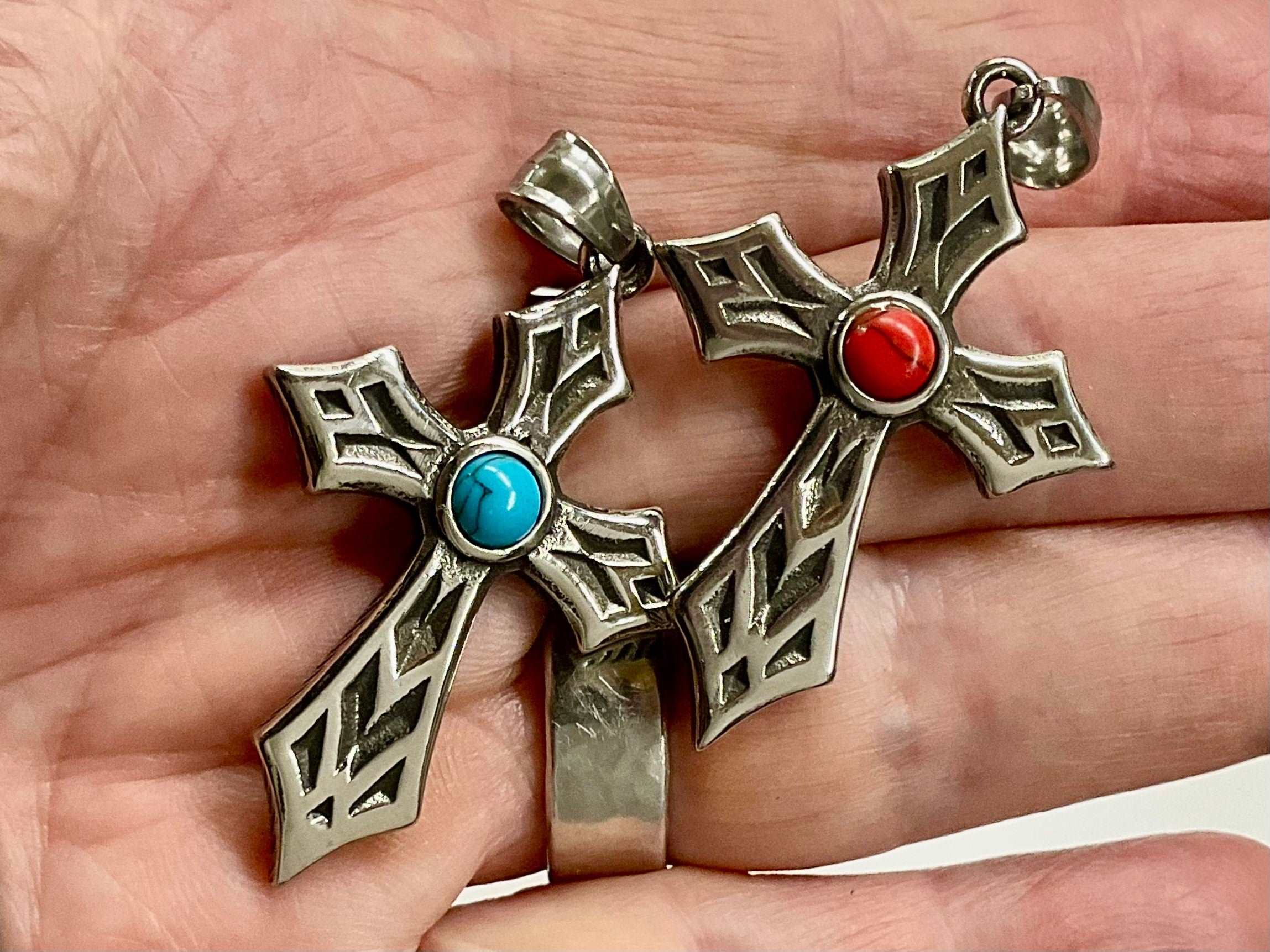Reversible cross necklace with silver-toned Celtic knot cross and red/blue stones