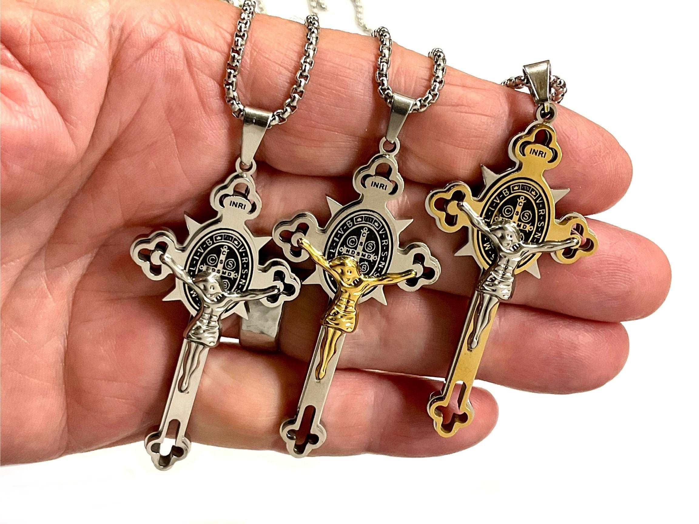 Crucifix cross necklace with St. Benedict medal, gold-and-silver tone pendant and chain links