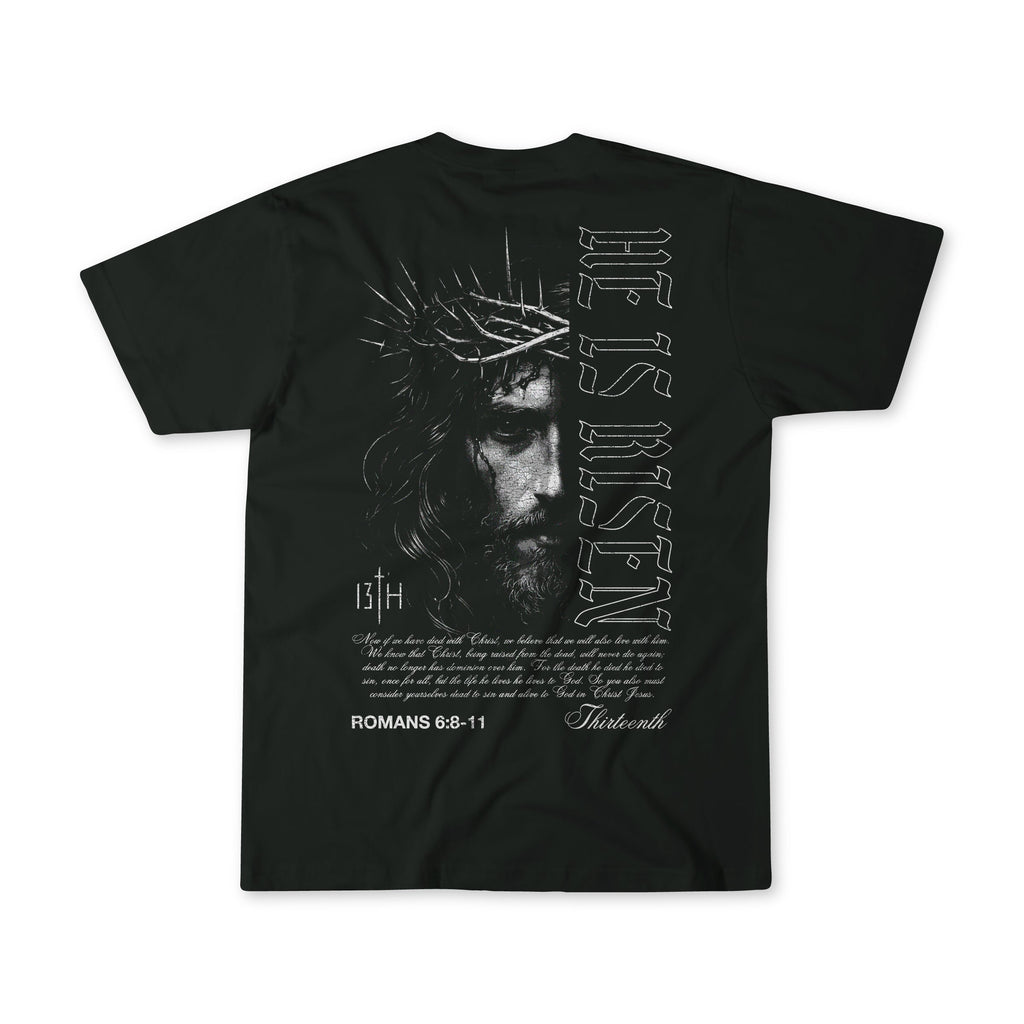 Black graphic t-shirt on white background with back portrait and scripture text