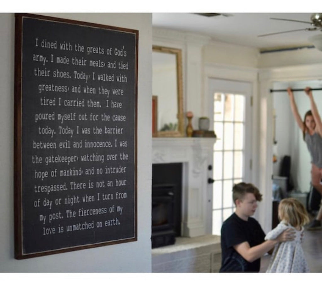 Framed wood wall sign with dark background and white inspirational quote
