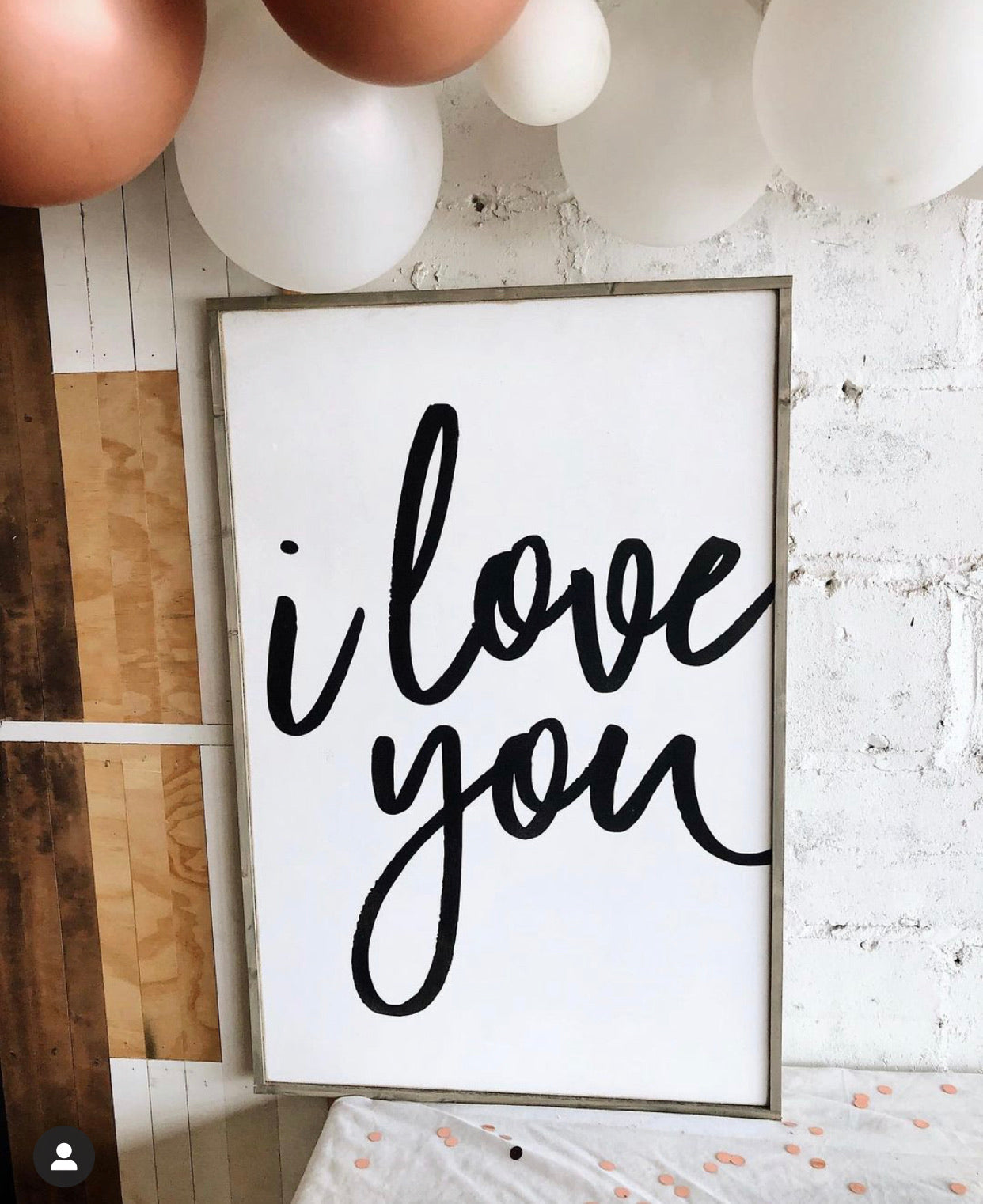 Modern wood wall sign with black cursive 'I love you' text