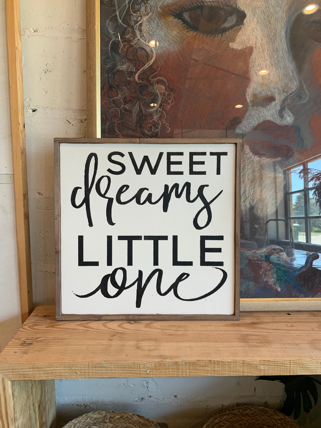 Sweet dreams little one wall sign with cursive script in white and black