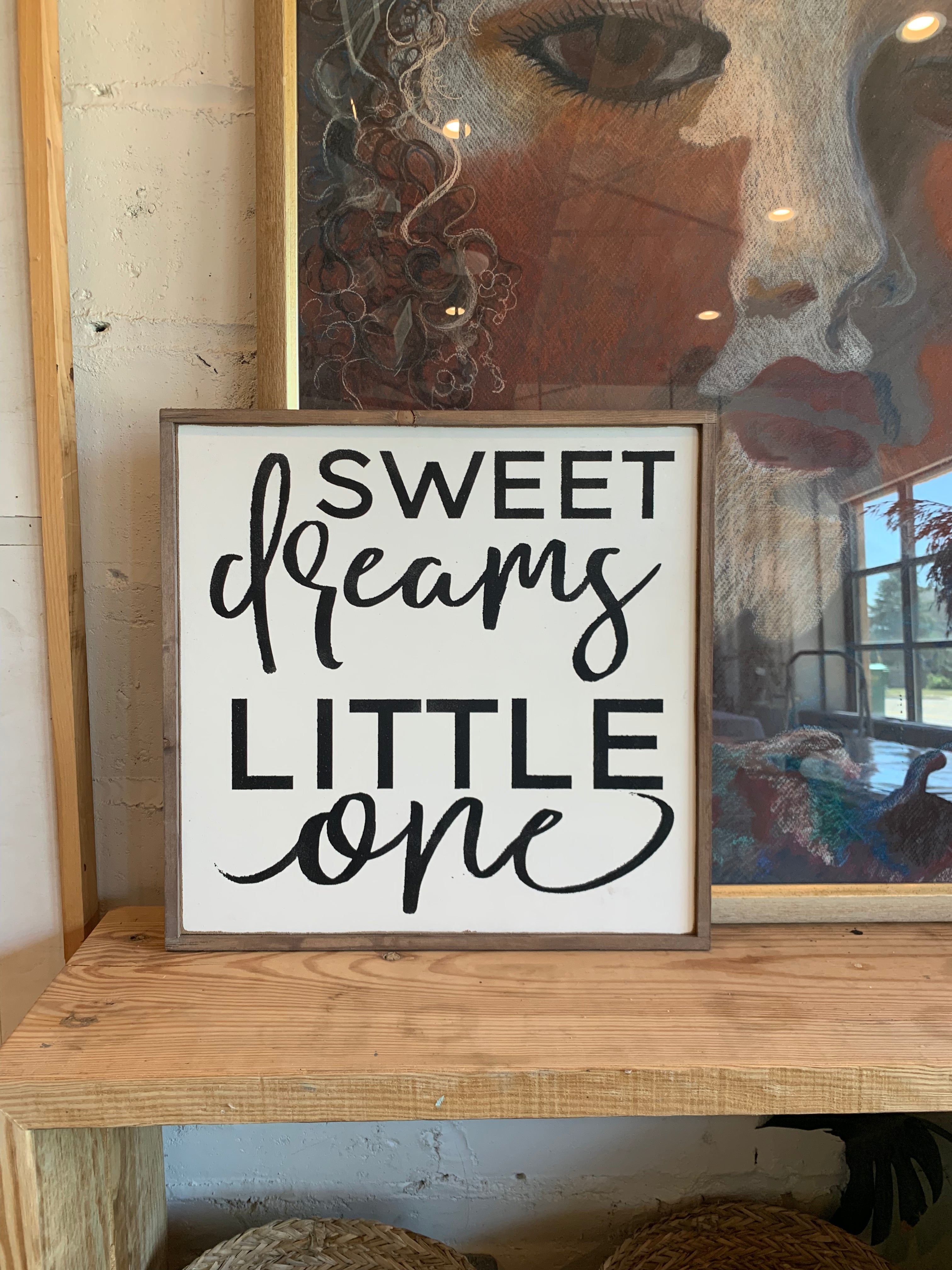 Sweet dreams little one wall sign with cursive script in white and black