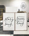 Framed wall art set of 2 with black script text: story/song and favor/long