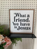 Framed Christian wall sign with text “What a friend, we have in Jesus”.