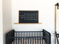 Wood-framed chalkboard wall hanging with quote text, dark center, light border.