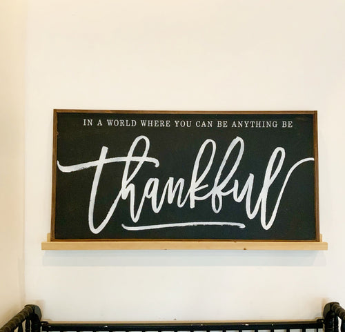 Framed farmhouse wall decor with black chalkboard and white script 'thankful'