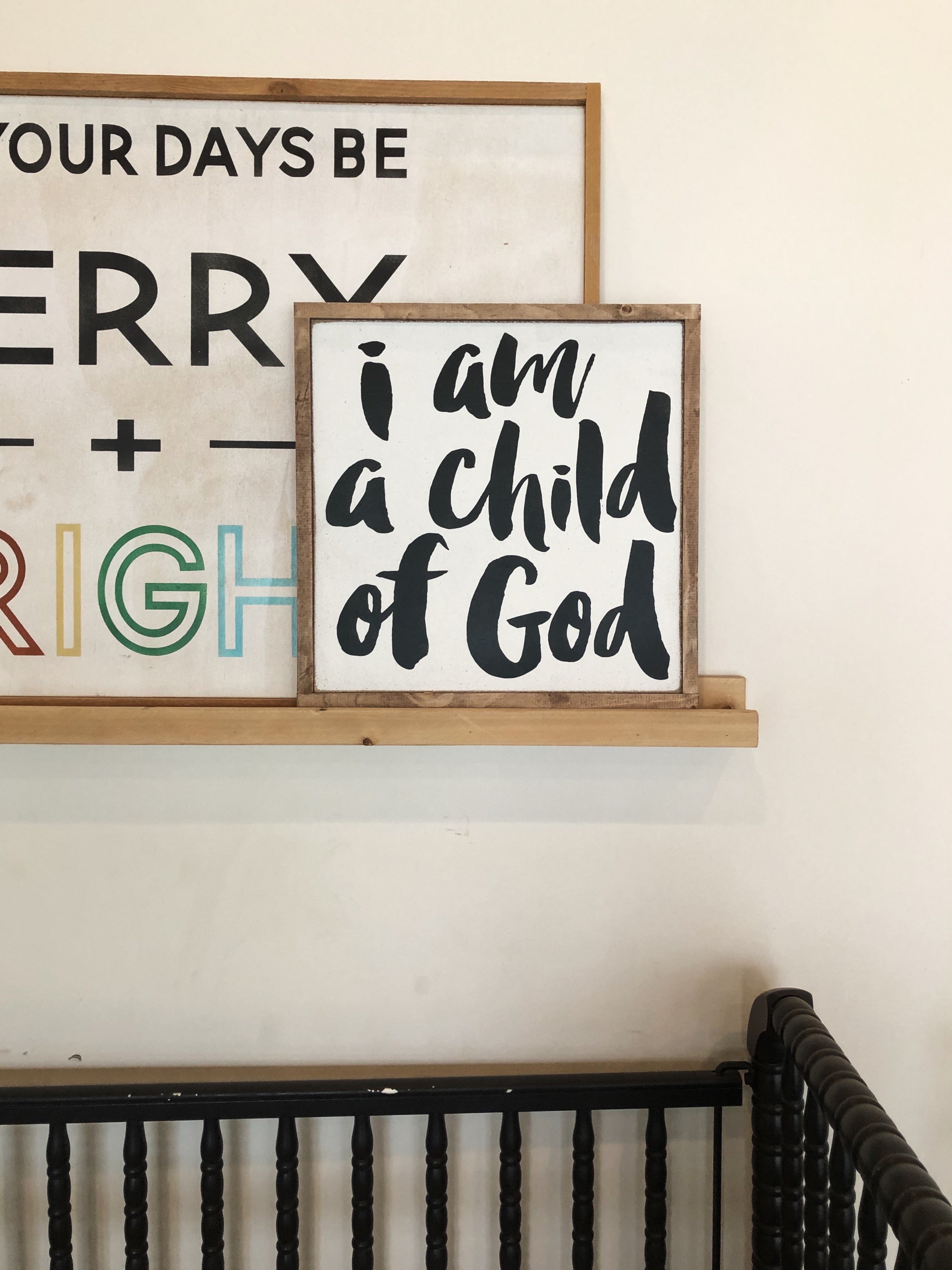 Framed wall art set of two wood-tone signs with “I am a child of God” text