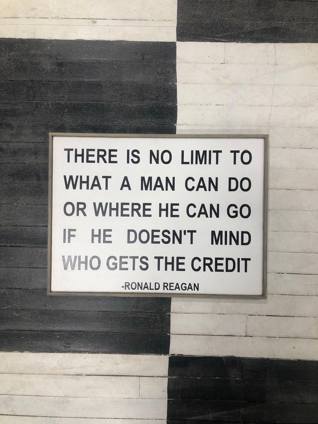 Framed wood quote sign reading 'There is no limit...' by Ronald Reagan