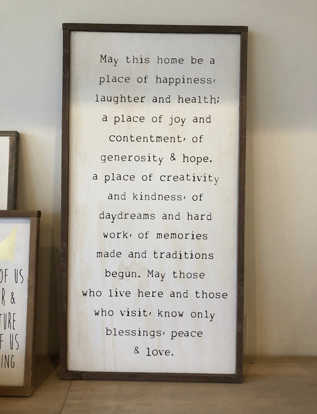 Framed wood wall sign with “place of happiness” quote, dark brown frame