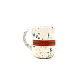 Speckled ceramic mug with handle, reads “JESUS IS CALLING”