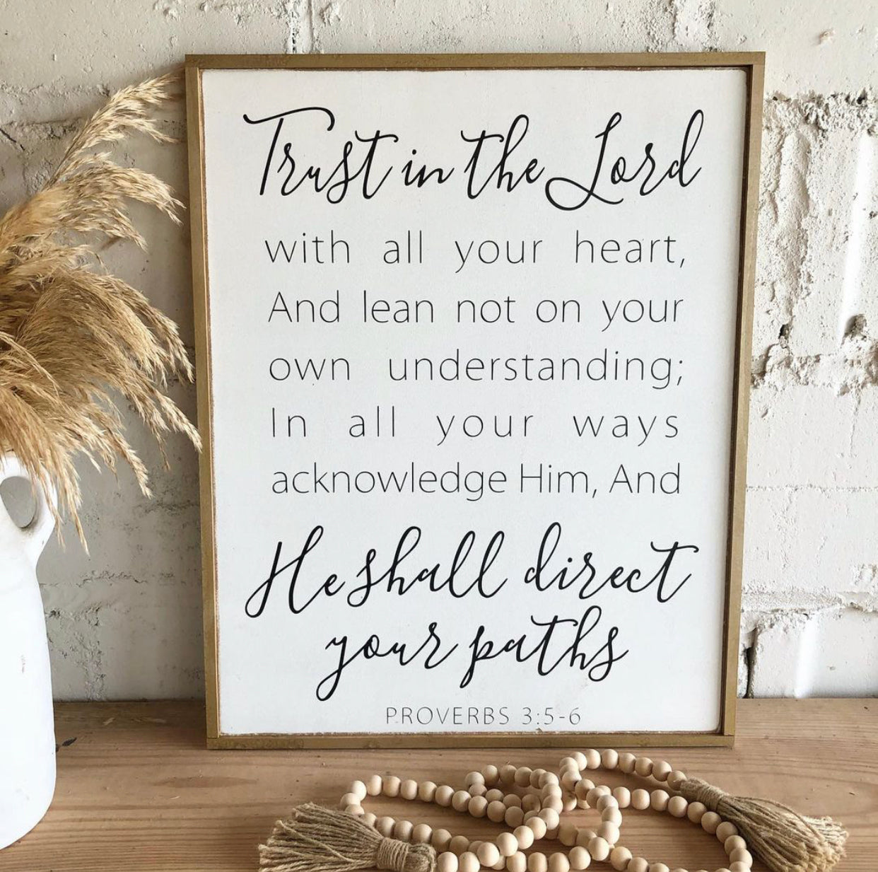 Framed wooden wall sign with “Trust in the Lord” scripture quote