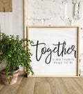 Framed wood wall art with black script 'Together' on white background
