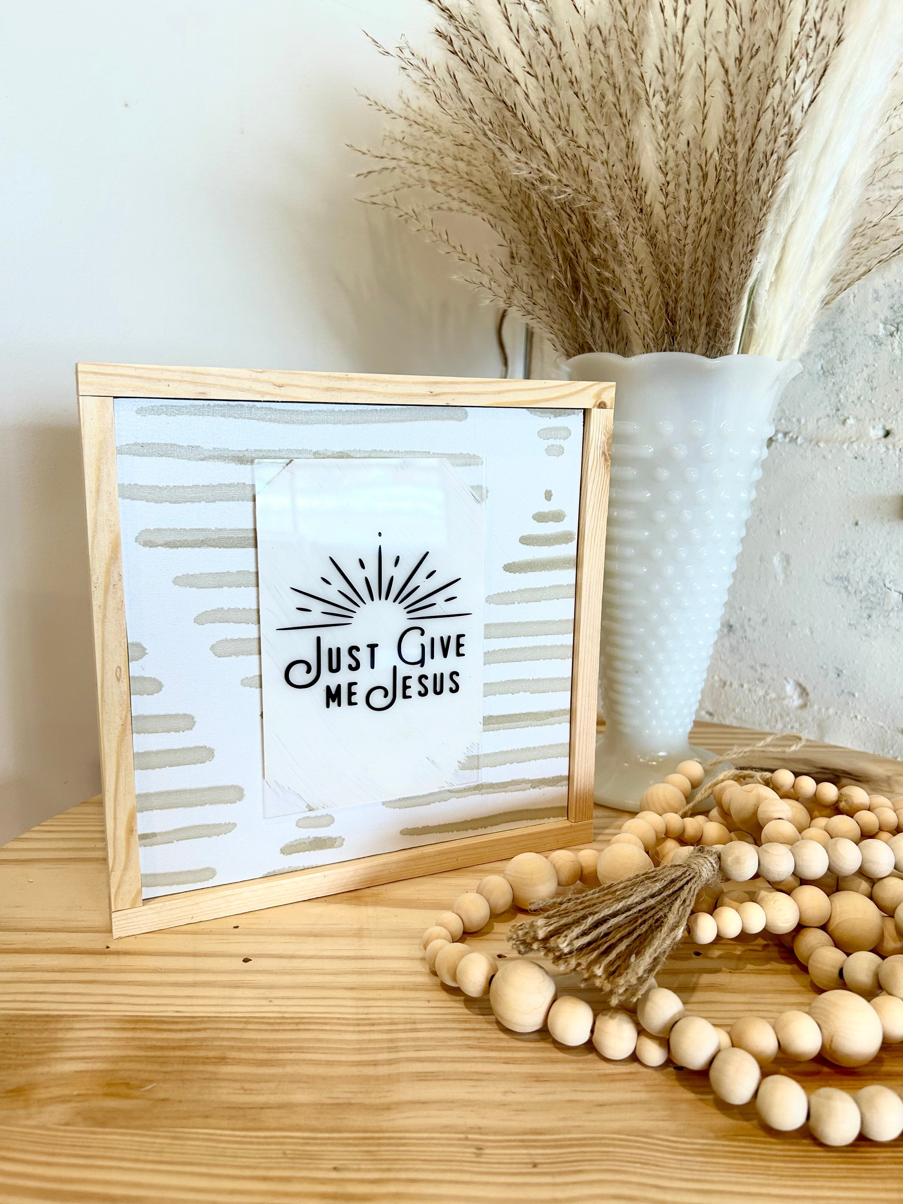 Wood-framed wall sign with white panel and 'Just Give Me Jesus' text