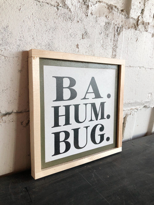 Framed wall art sign: 'BA. HUM. BUG.' black text on light background