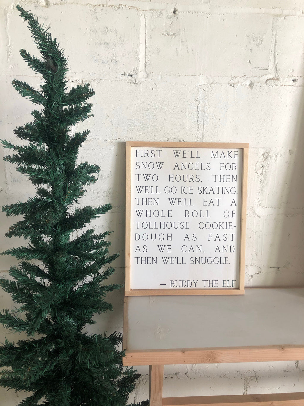 Buddy the Elf framed wall art with quote text in light wood frame