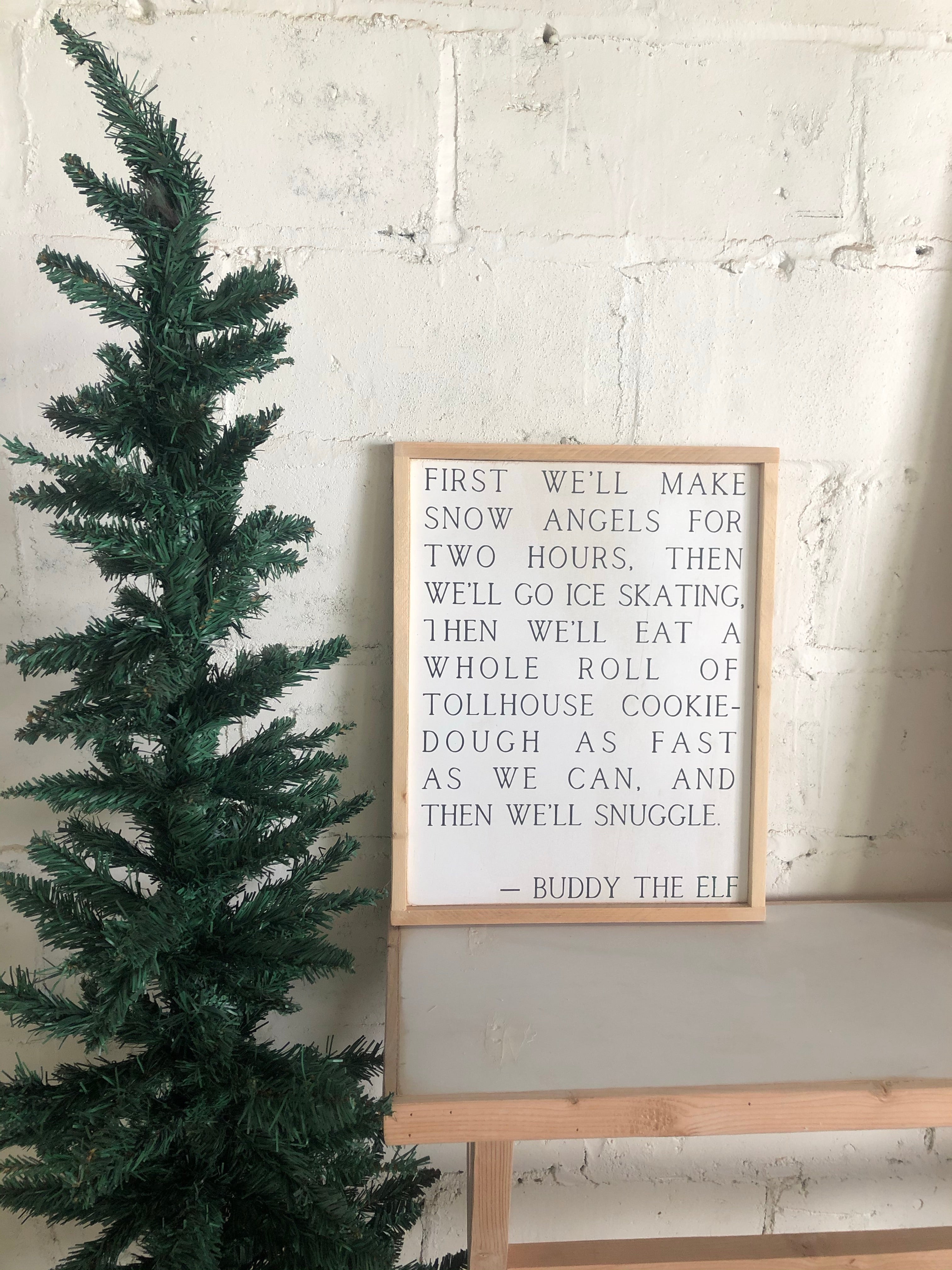 Buddy the Elf framed wall art with quote text in light wood frame