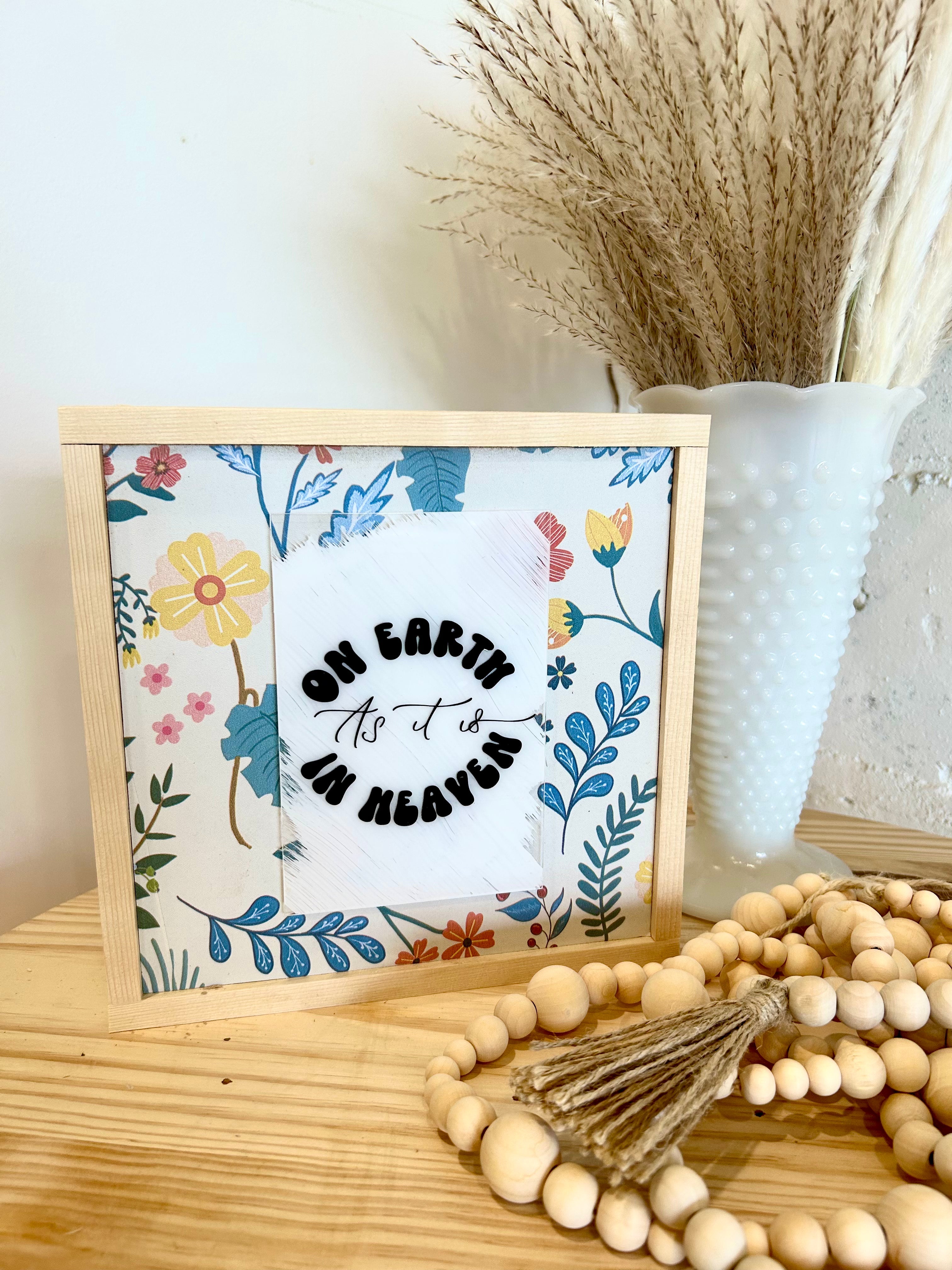 Farmhouse wall sign with colorful floral border and script quote text