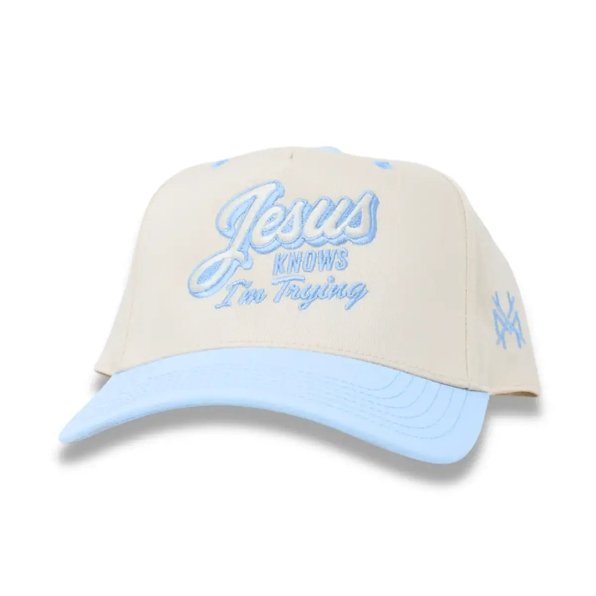 Cream and light blue snapback hat with front script logo and side embroidered crossmark