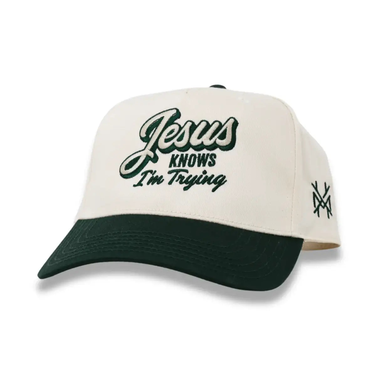 Cream and dark green snapback hat with front script logo and side embroidered crossmark