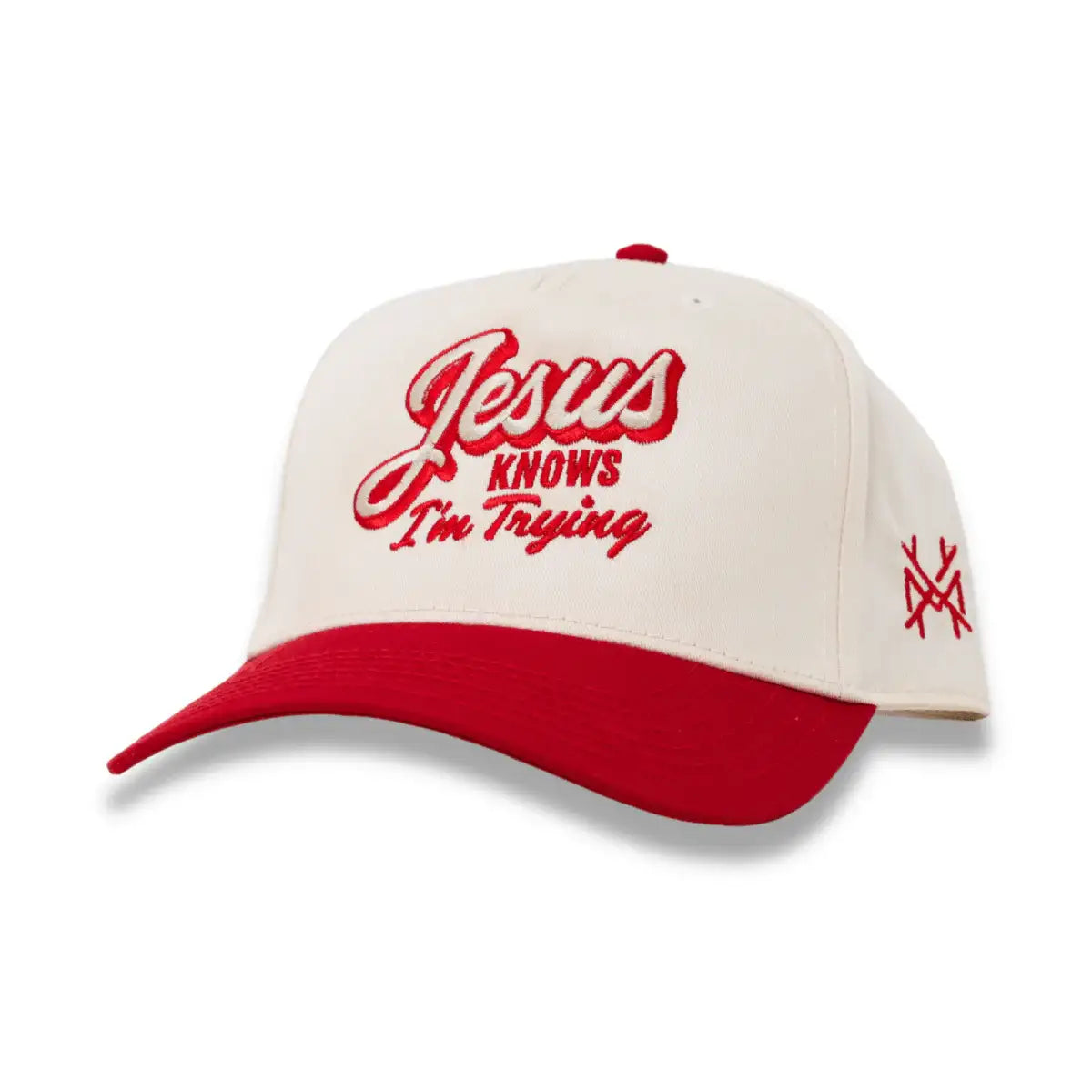 Cream and red snapback hat with front script logo and side embroidered crossmark