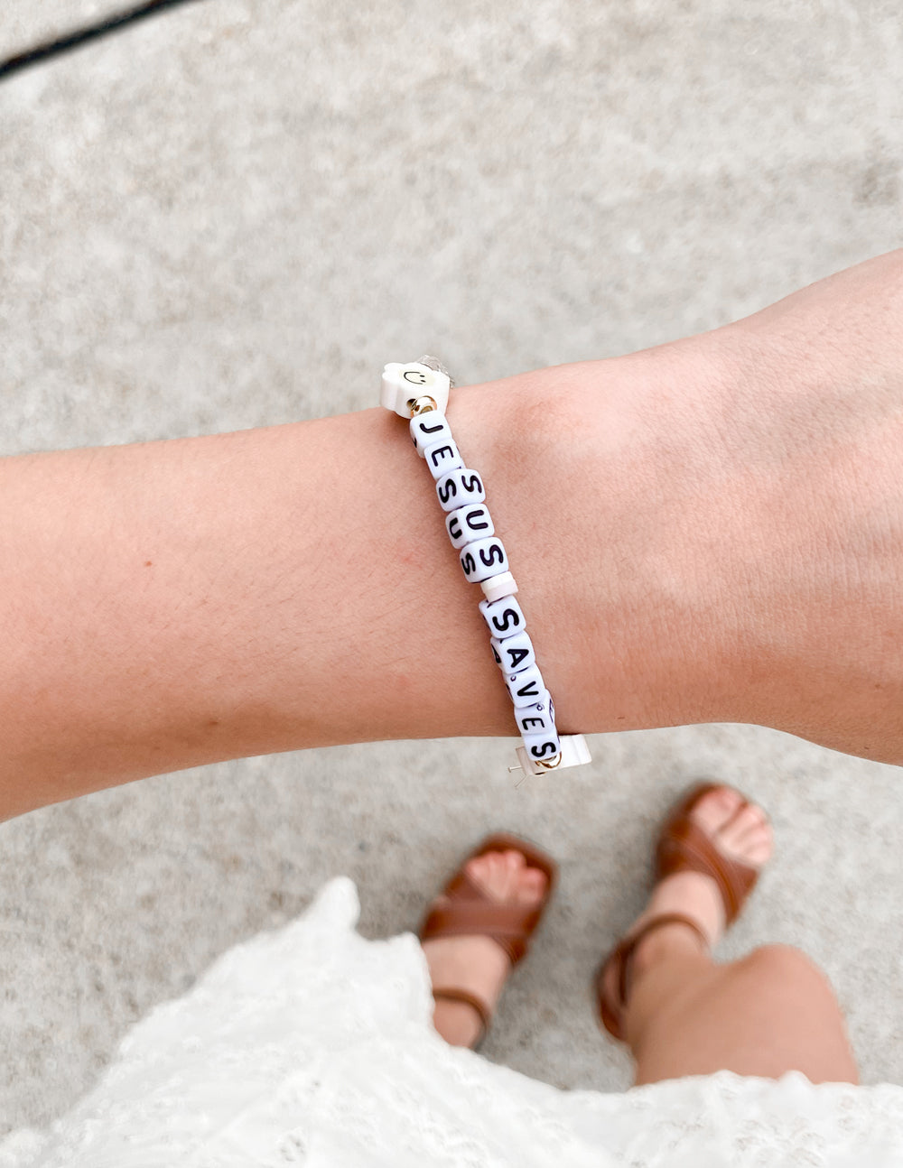 Beaded letter bracelet with 'Jesus Saves' white tiles and small smiley charm beads