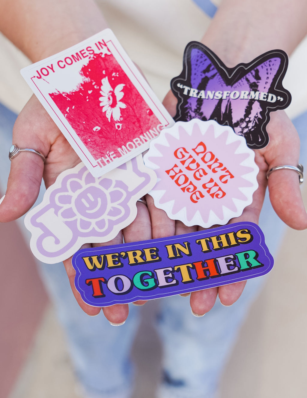 Assorted sticker pack with floral and 'We're in this together' blue banner