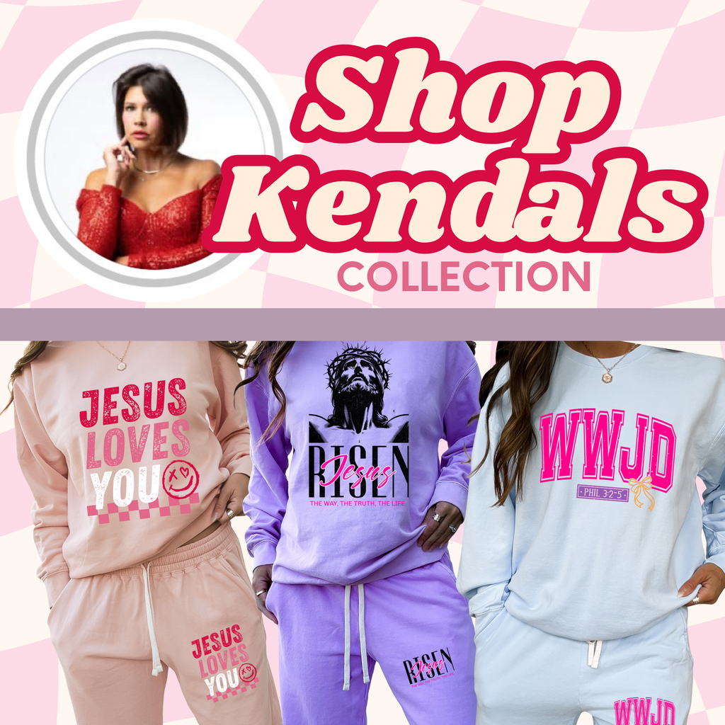 Light blue sweatpants with drawstring waist and pink “WWJD” graphic on thigh.