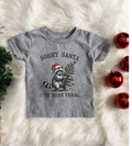 Kids graphic T-shirt, gray crewneck with Santa bear print and text Sorry Santa, I’ve Been Feral