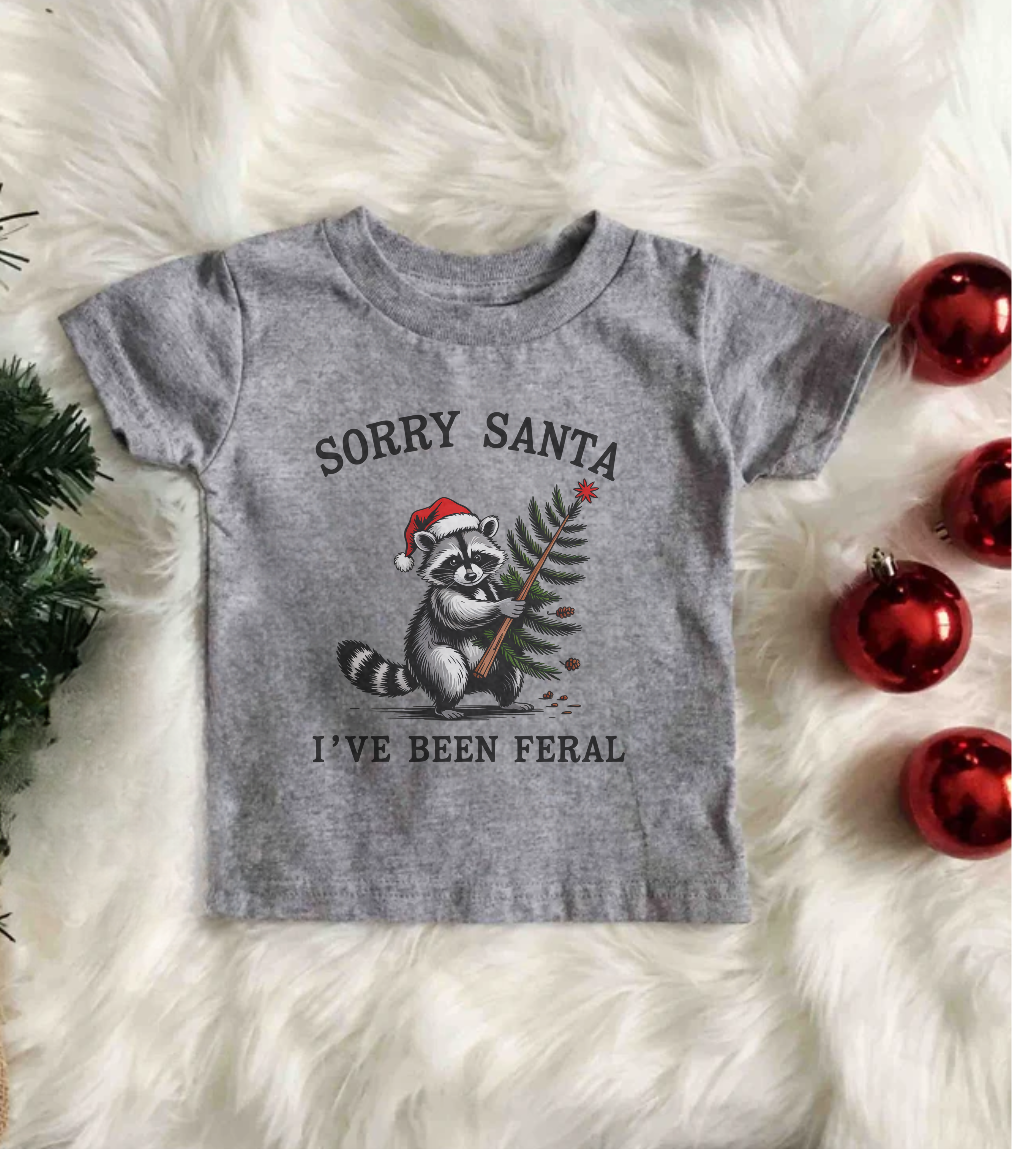 Kids graphic T-shirt, gray crewneck with Santa bear print and text Sorry Santa, I’ve Been Feral