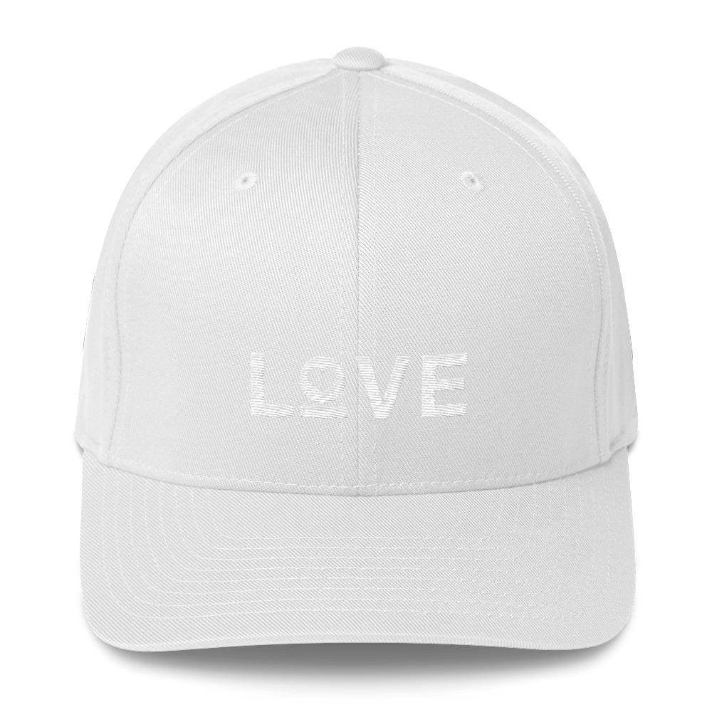 White fitted baseball cap with light-colored LOVE and heart logo on front.