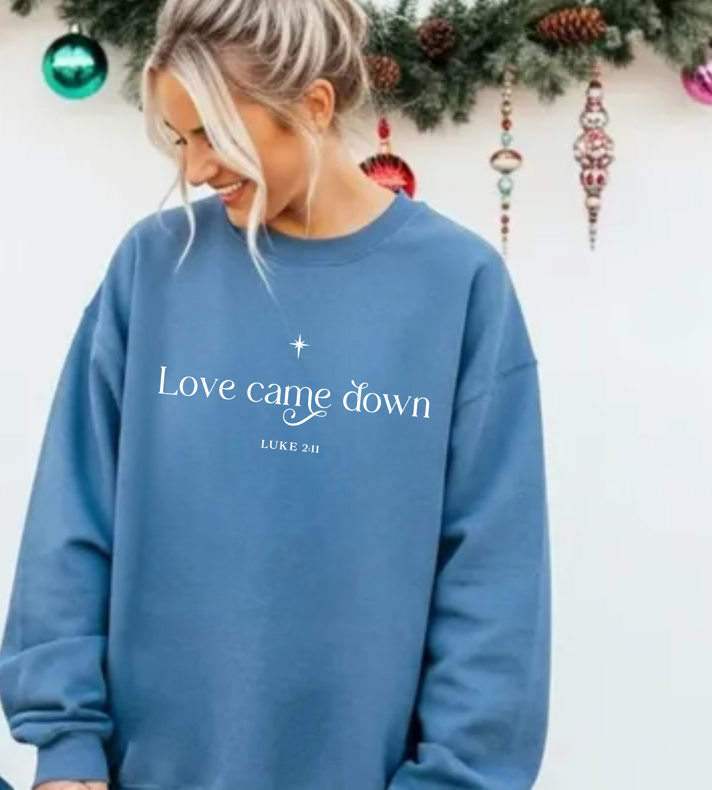 Blue long-sleeve T-shirt with 'Love came down' front print and small star above