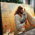 Landscape canvas wall art showing man holding a white horse with red flowers